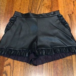 Black leather ruffled shorts